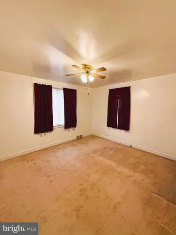 a view of a livingroom with a ceiling fan