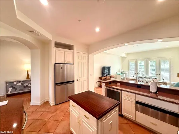 a kitchen with a stove a refrigerator and a sink