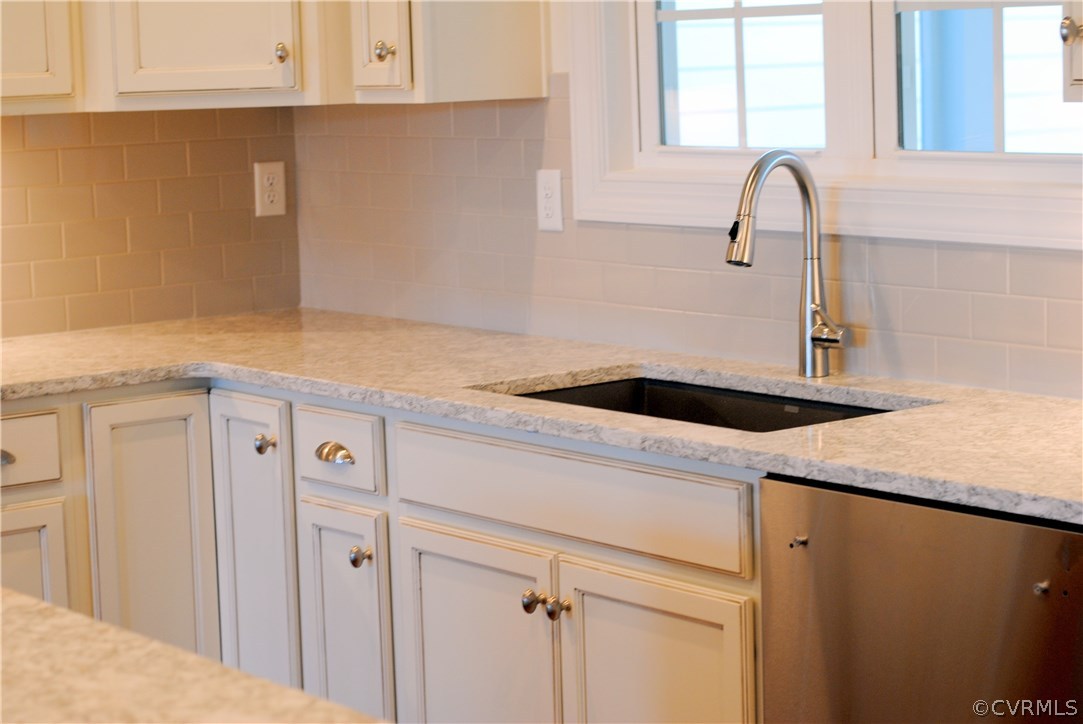 1407 Winterfield Road Midlothian, VA 23113 - Photo 5 of 13 a kitchen with a sink and cabinets