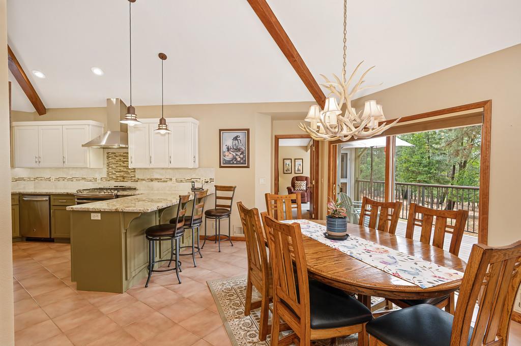 29082 Ridge View Road Foresthill, CA 95631 - Photo 13 of 78 a view of a dining room with furniture wooden floor and chandelier
