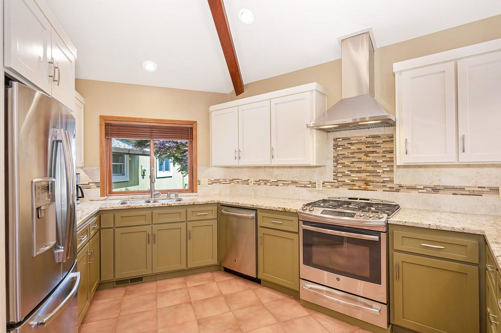 29082 Ridge View Road Foresthill, CA 95631 - Photo 15 of 78 a kitchen with a stove sink and cabinets