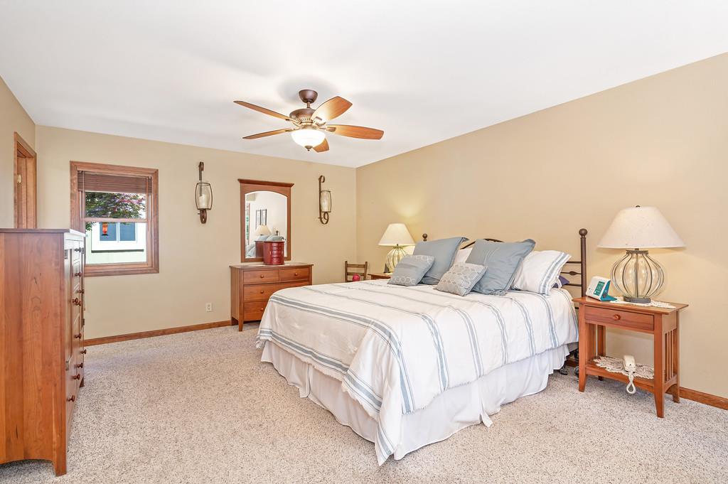 29082 Ridge View Road Foresthill, CA 95631 - Photo 19 of 78 a bedroom with a bed and a chandelier