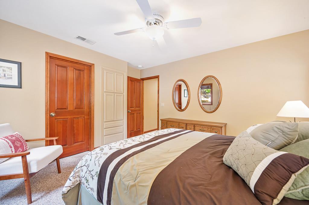 29082 Ridge View Road Foresthill, CA 95631 - Photo 29 of 78 a bedroom with a bed and dresser with wooden floor