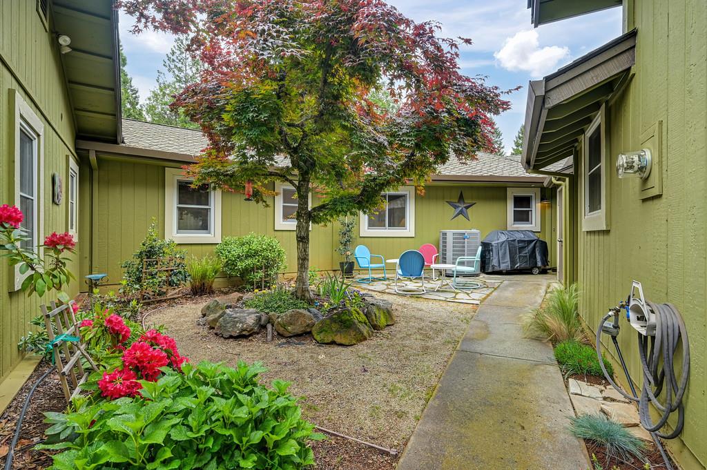 29082 Ridge View Road Foresthill, CA 95631 - Photo 45 of 78 a front view of a house with fountain plants and entertaining space
