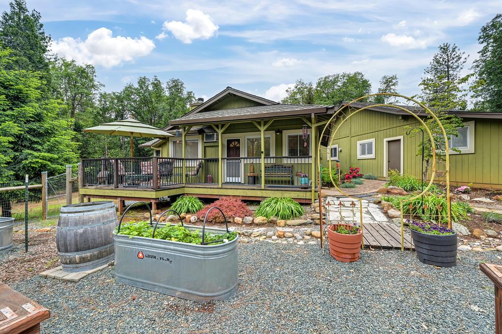 29082 Ridge View Road Foresthill, CA 95631 - Photo 48 of 78 a view of a house with sitting area and garden