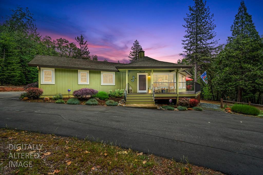 29082 Ridge View Road Foresthill, CA 95631 - Photo 6 of 78 a front view of a house with a garden