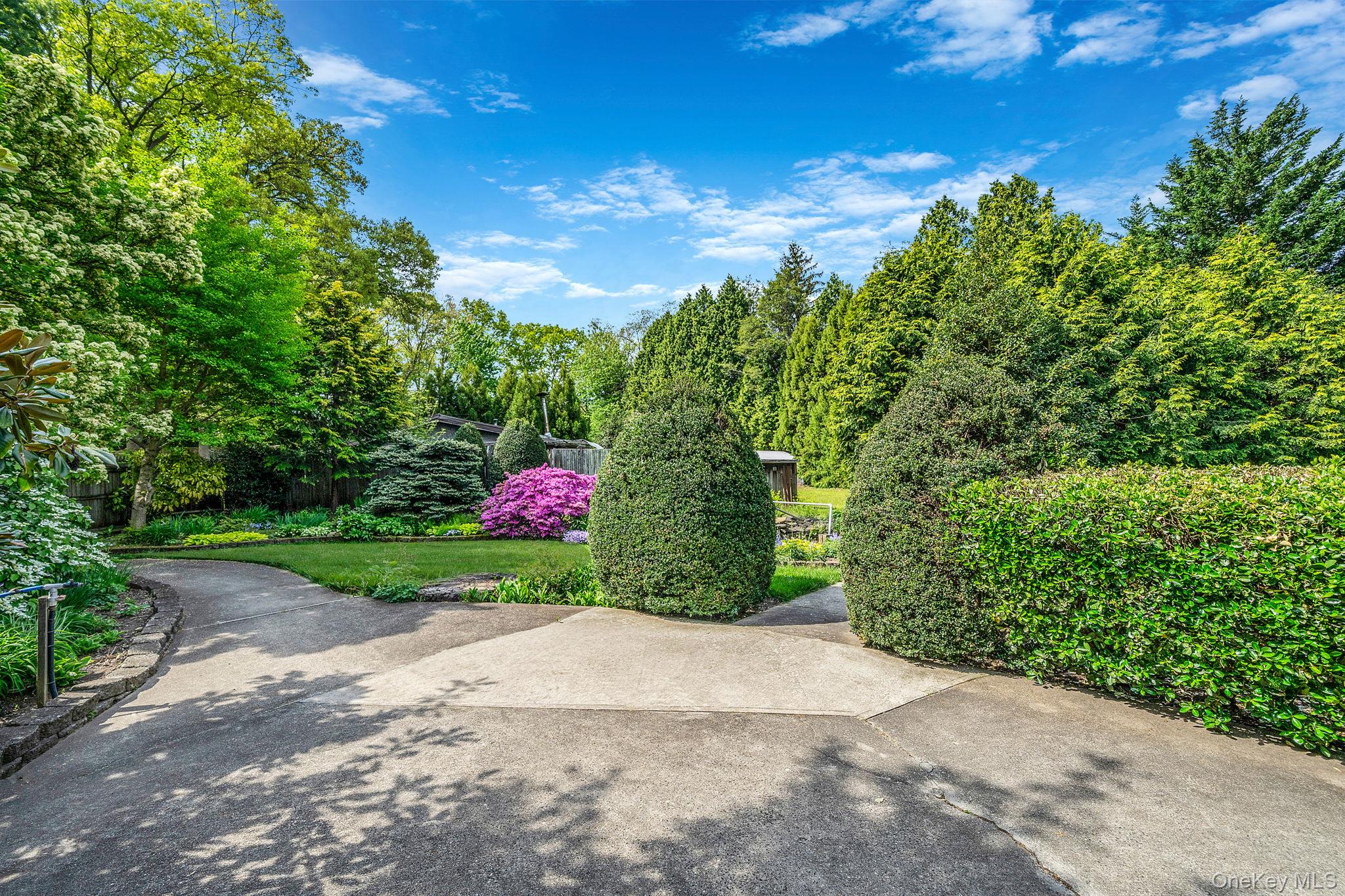 280 Deforest Road North Dix Hills, NY 11746 - Photo 13 of 37 a view of a road with a small yard