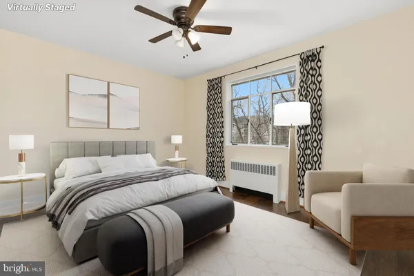 a bedroom with a bed and a couch