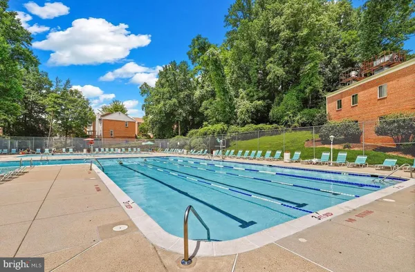 a view of swimming pool with a yard