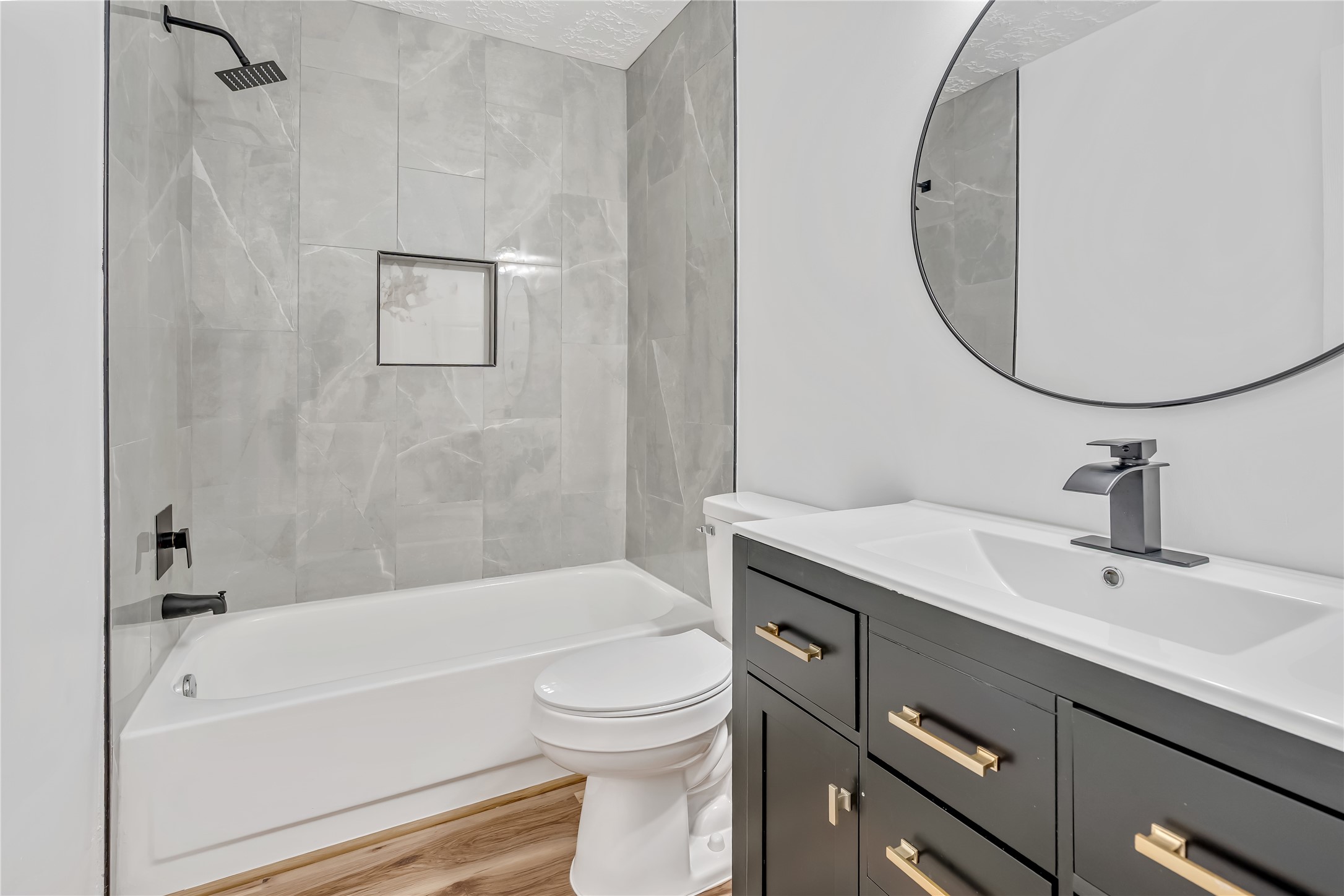 12426 North Rachlin Circle Houston, TX 77071 - Photo 17 of 31 a bathroom with a sink a toilet and a mirror