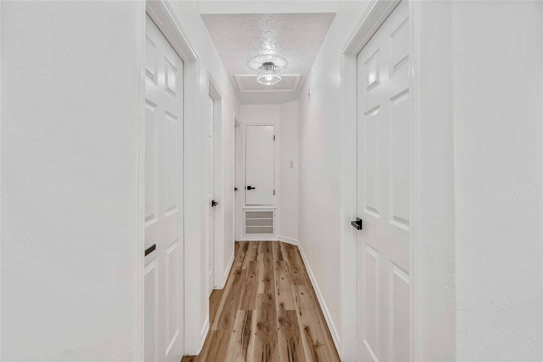 12426 North Rachlin Circle Houston, TX 77071 - Photo 21 of 31 a view of a room with wooden floor and white walls