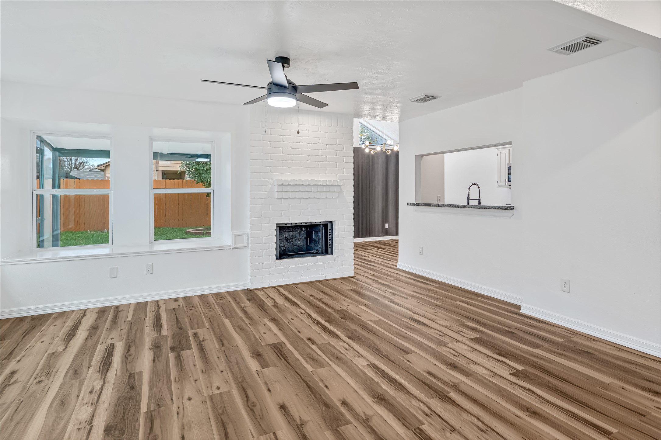 12426 North Rachlin Circle Houston, TX 77071 - Photo 22 of 31 a view of empty room with wooden floor and fan