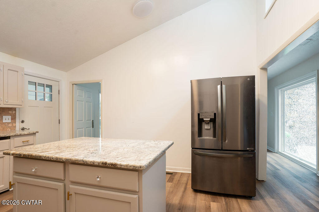 7 Timberlake Drive Jackson, TN 38305 - Photo 10 of 38 a kitchen with granite countertop a refrigerator and a sink
