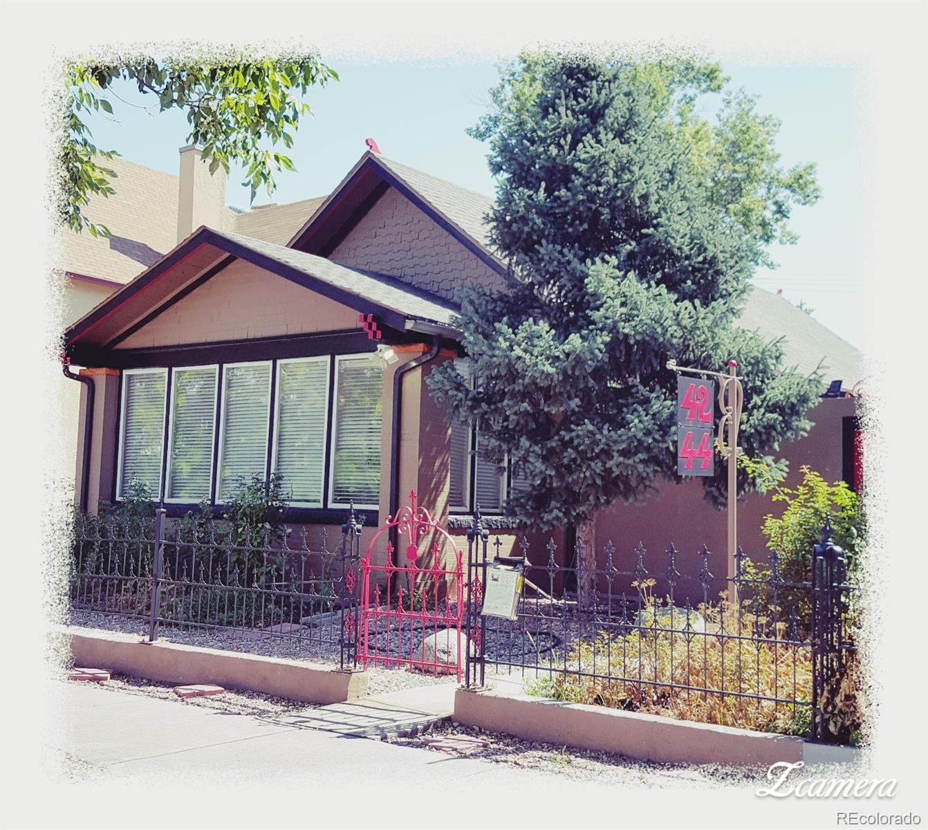 44 Lincoln Street Denver, CO 80203 - Photo 1 of 35 a front view of a house with a yard