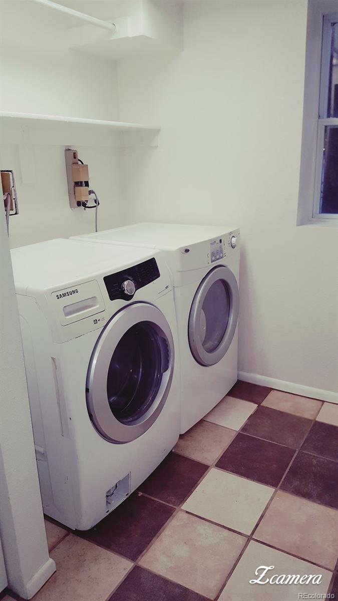 44 Lincoln Street Denver, CO 80203 - Photo 16 of 35 a utility room with dryer and washer
