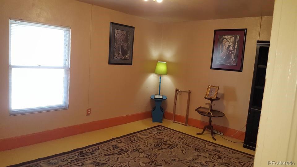 44 Lincoln Street Denver, CO 80203 - Photo 28 of 35 a view of a room with wooden floor and a window