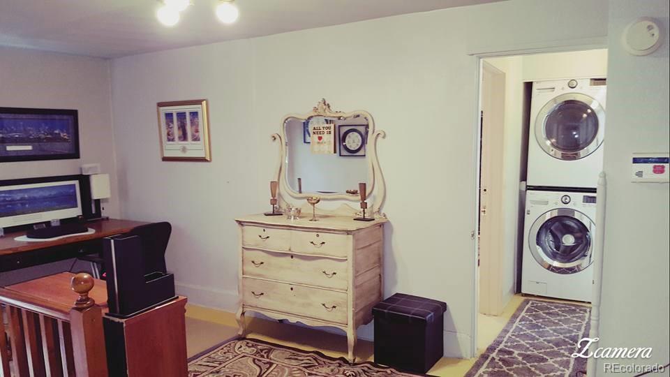 44 Lincoln Street Denver, CO 80203 - Photo 32 of 35 a view of a bedroom with washer and dryer