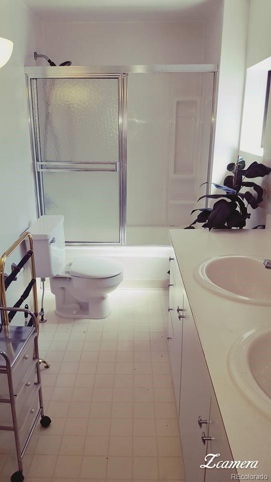 44 Lincoln Street Denver, CO 80203 - Photo 34 of 35 a bathroom with a sink and a mirror