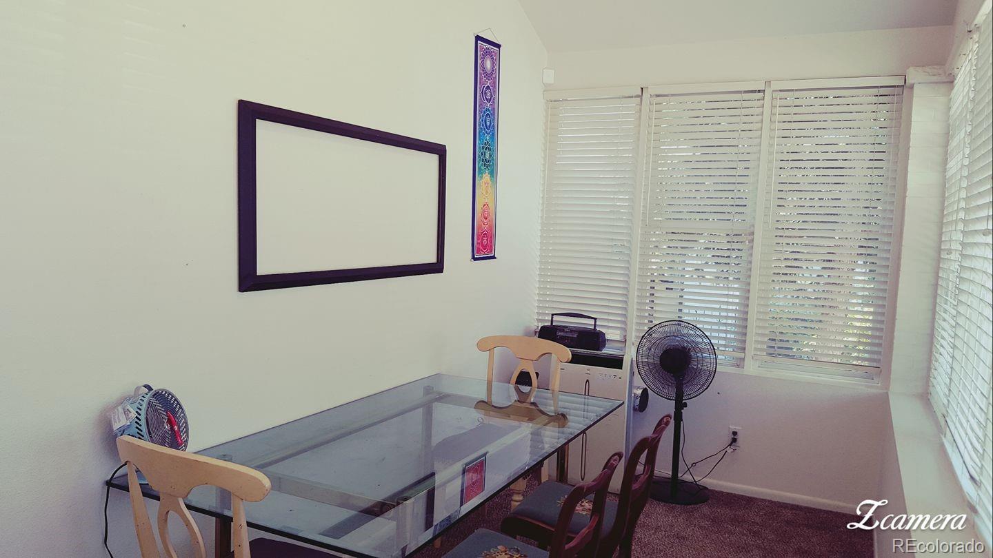 44 Lincoln Street Denver, CO 80203 - Photo 9 of 35 a view of a workspace with furniture and a window