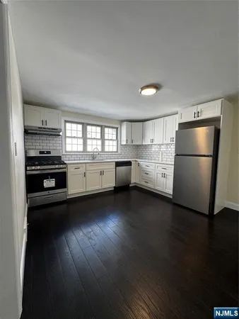 a kitchen with appliances and cabinets