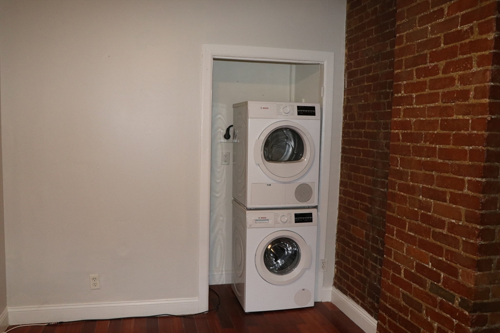 320 Warren Street, Unit 2 Boston, MA 02119 - Photo 18 of 22 a utility room with dryer and washer