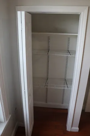 a bathroom with a glass shower door