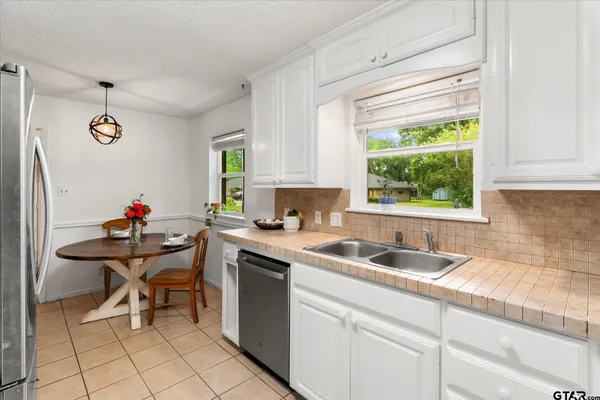 a kitchen with a sink and cabinets