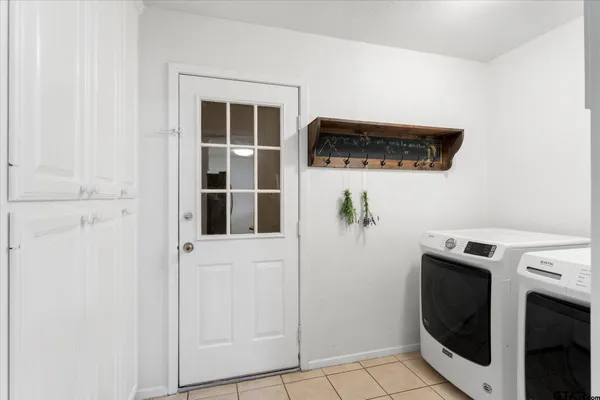 a utility room with dryer and washer