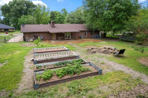 an aerial view of a multi story residential apartment building with yard