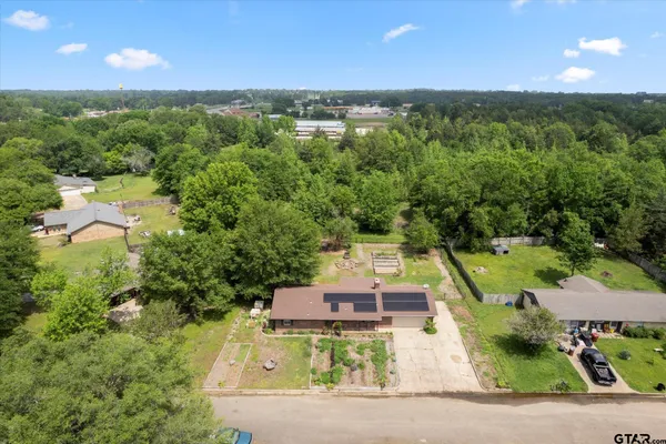 a view of a yard with an outdoor seating