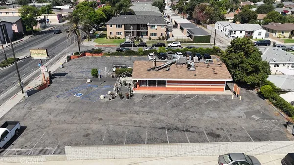 an aerial view of a house with a yard