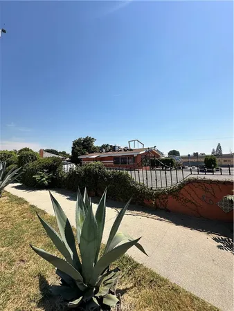 a view of a street with cars on the road