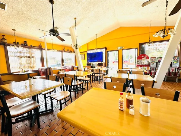 a view of a dining area with furniture window and outside view