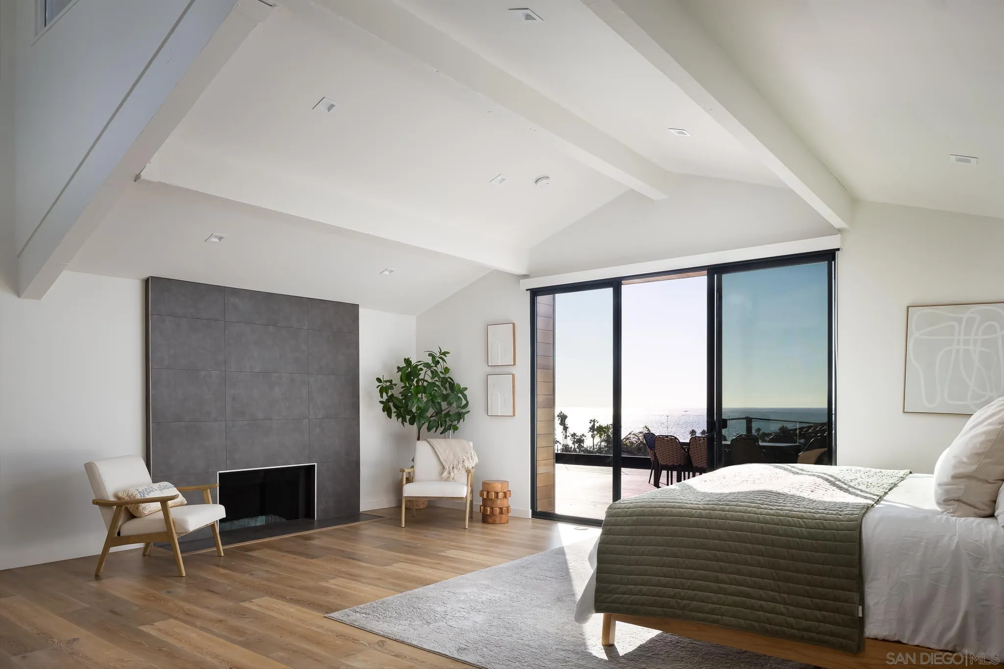 949 Cornish Drive San Diego, CA 92107 - Photo 17 of 28 a bedroom with a bed and a fireplace