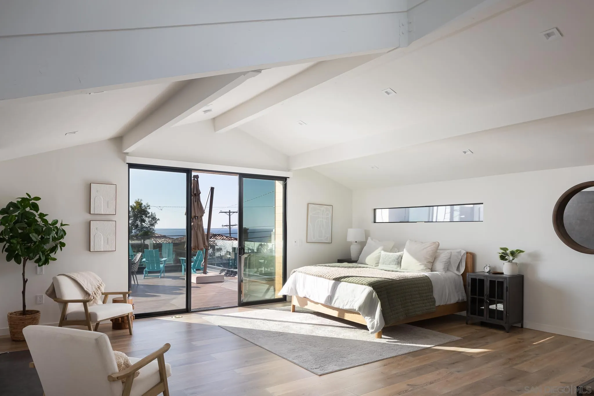 949 Cornish Drive San Diego, CA 92107 - Photo 18 of 28 a bedroom with a bed and a large window