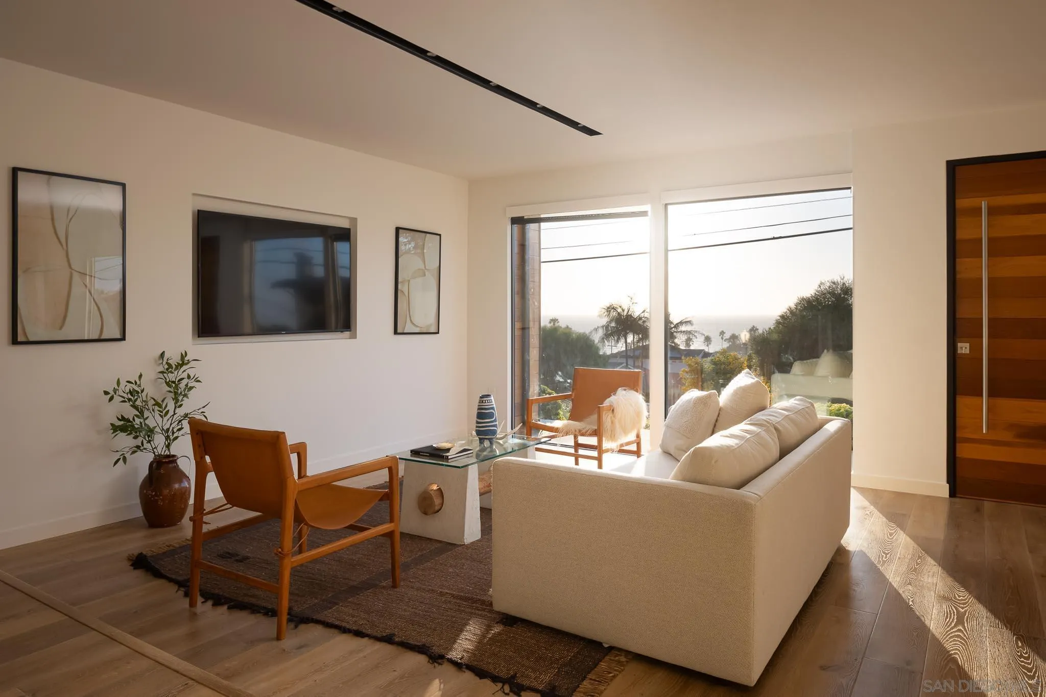 949 Cornish Drive San Diego, CA 92107 - Photo 7 of 28 a living room with furniture and a floor to ceiling window