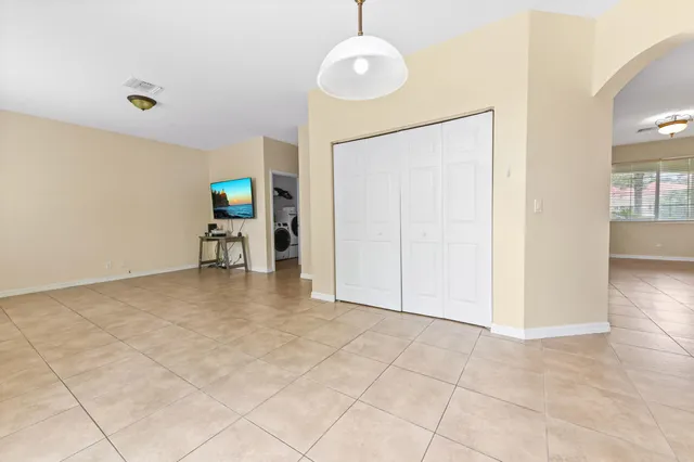 a view of kitchen with furniture and flat screen tv