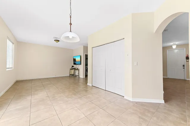 a view of a livingroom with furniture and a flat screen tv