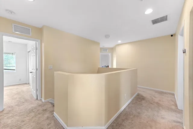 a view of a room with a flat screen tv