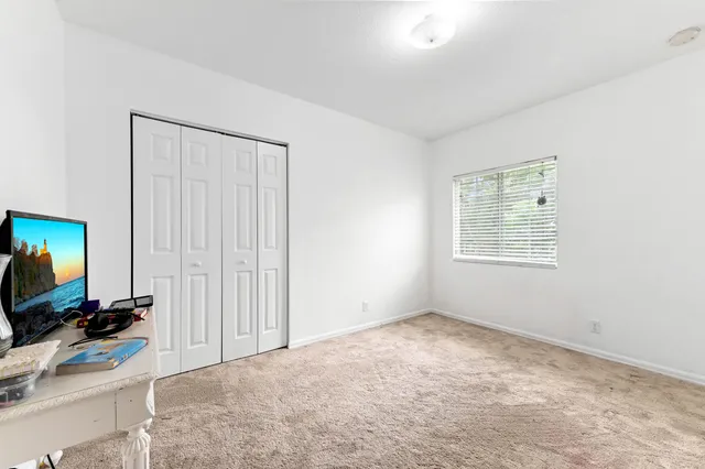 a view of storage and utility area with a window