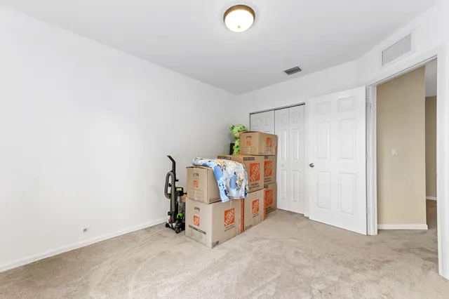 a bed room with a bed and a television