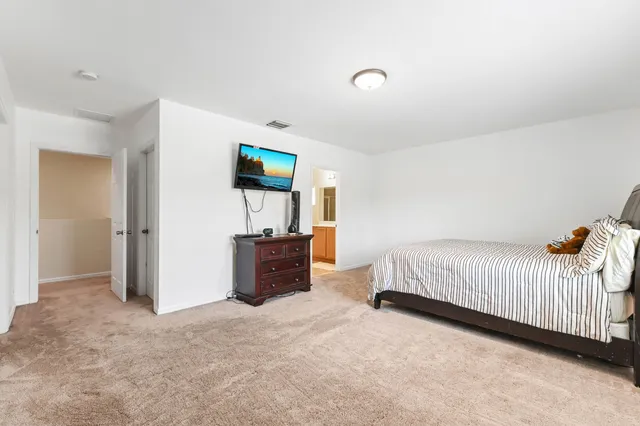 a bathroom with a sink a toilet and bathtub
