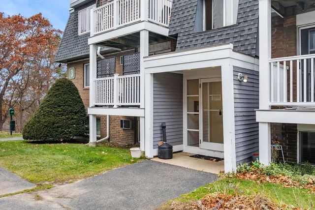 a view of a backyard with sitting area