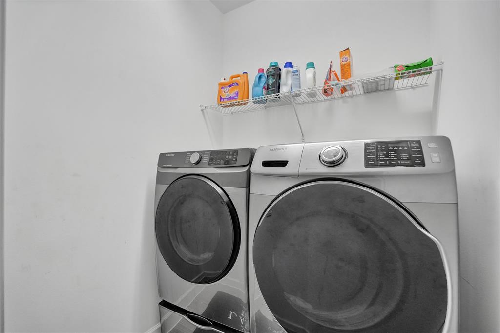 4875 Northwest 55th Place Tamarac, FL 33319 - Photo 35 of 44 a utility room with dryer and washer