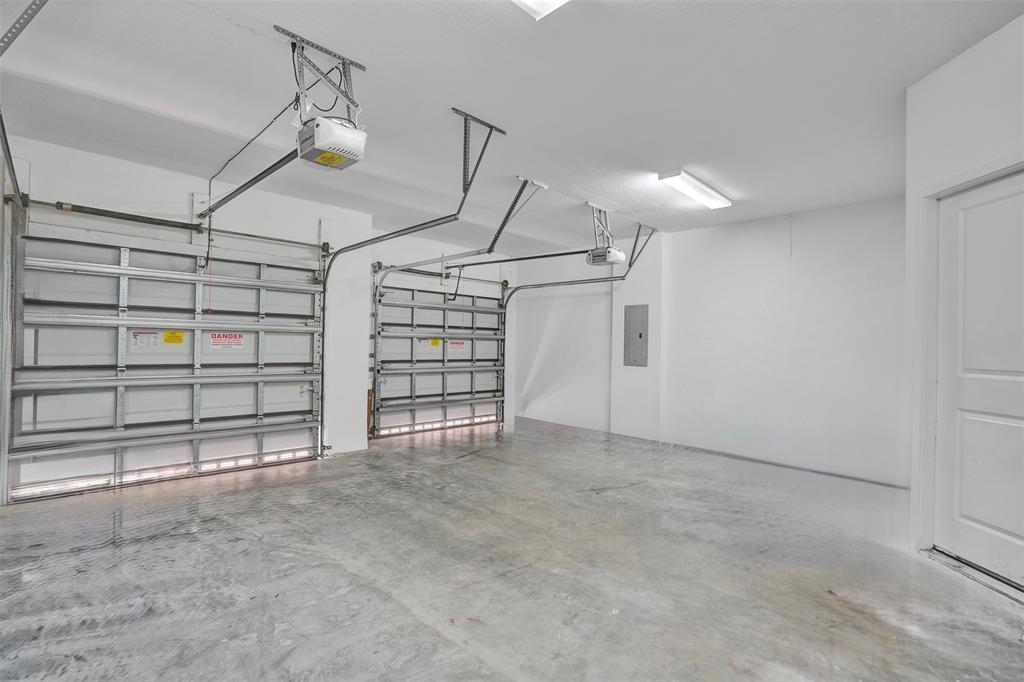 4875 Northwest 55th Place Tamarac, FL 33319 - Photo 36 of 44 a view of an empty room with windows