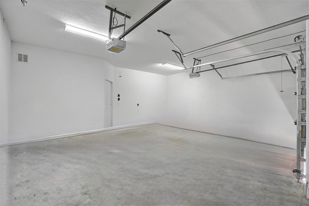 4875 Northwest 55th Place Tamarac, FL 33319 - Photo 37 of 44 a view of a room with racks on the wall