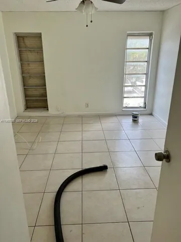 a view of empty room with windows