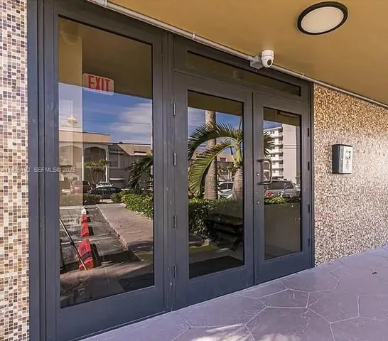 a view of a glass door of the house