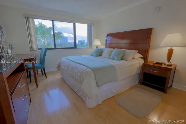 a bed room with a bed and a chair