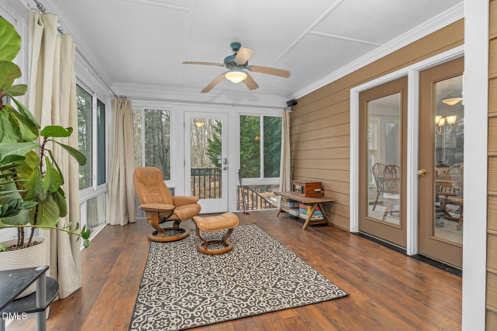259 Sacred Fire Road Louisburg, NC 27549 - Photo 19 of 35 a living room with furniture and a wooden floor